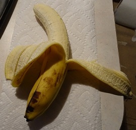 Banana with two peels image 2