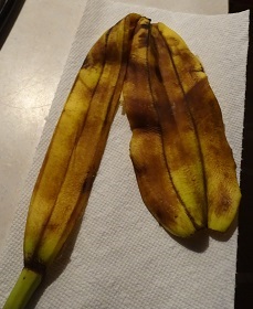 Banana with two peels image 4